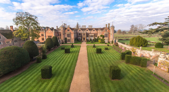 Front aerial view of Charlecote Park house and gardens